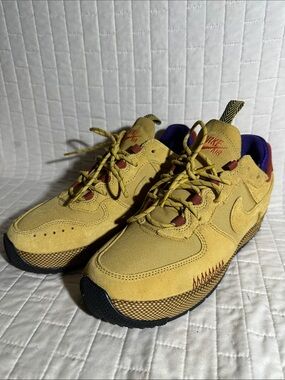 Nike Air Force 1 Wild Women's Shoes in the "Wheat Gold" colorway.